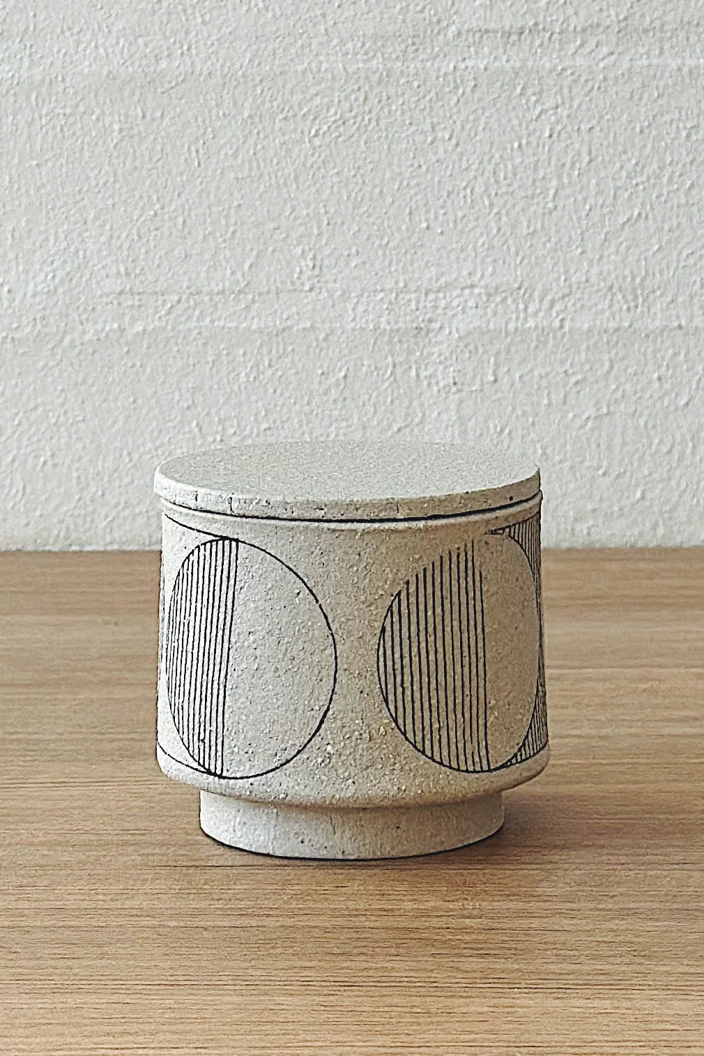 geometric white lidded vessel