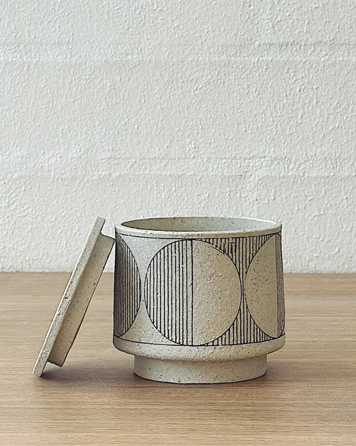 geometric white lidded vessel