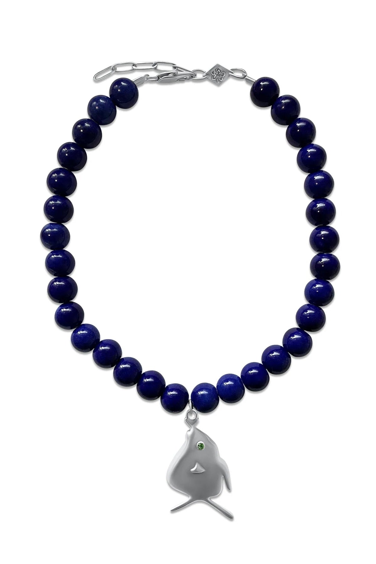 Navy blue beaded bracelet with a silver shark charm on a white background