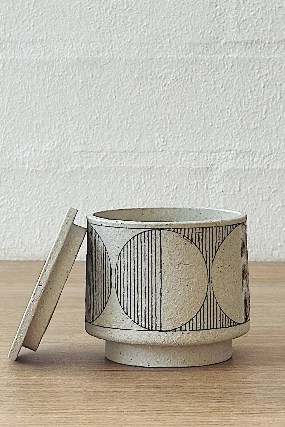 geometric white lidded vessel