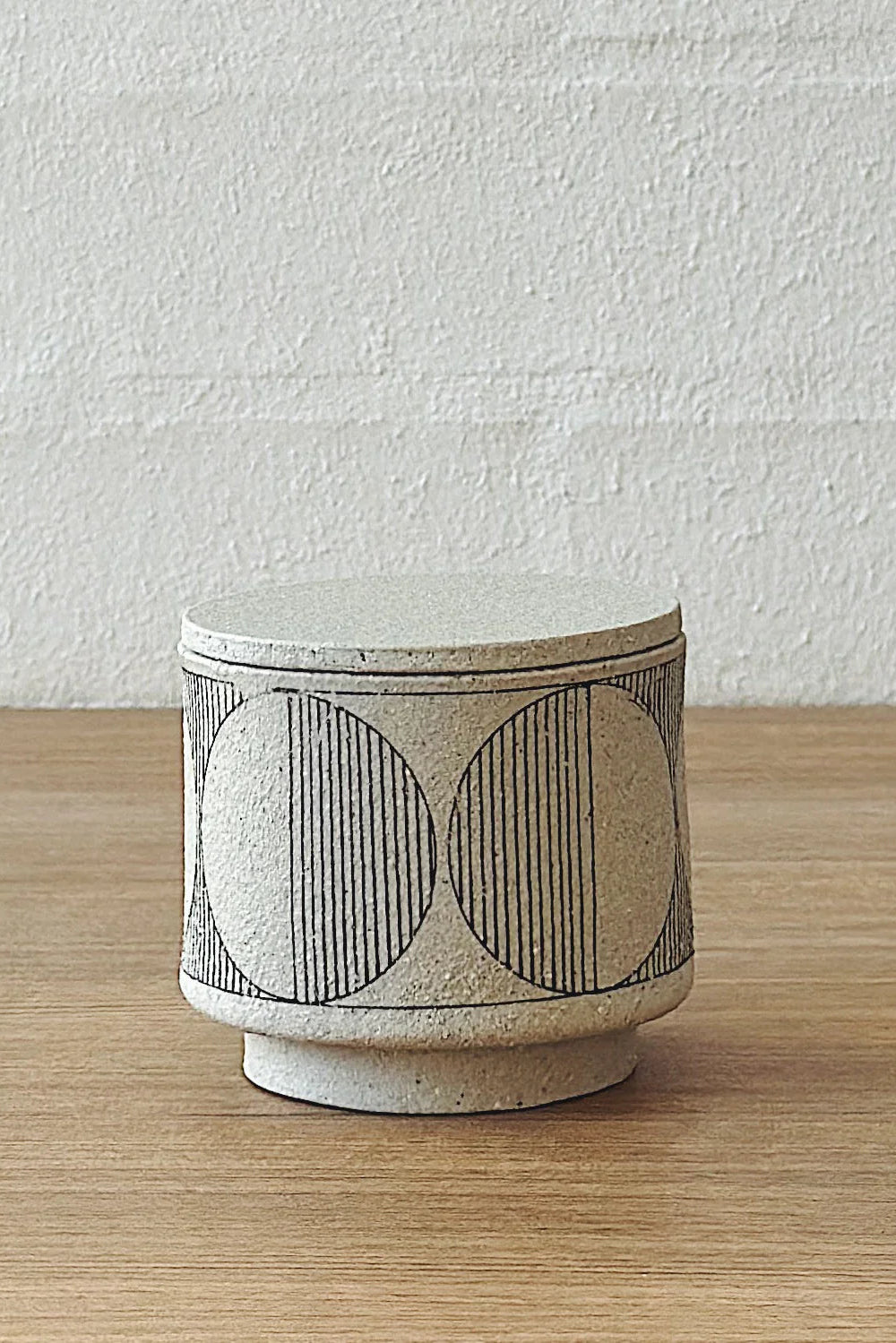 geometric white lidded vessel