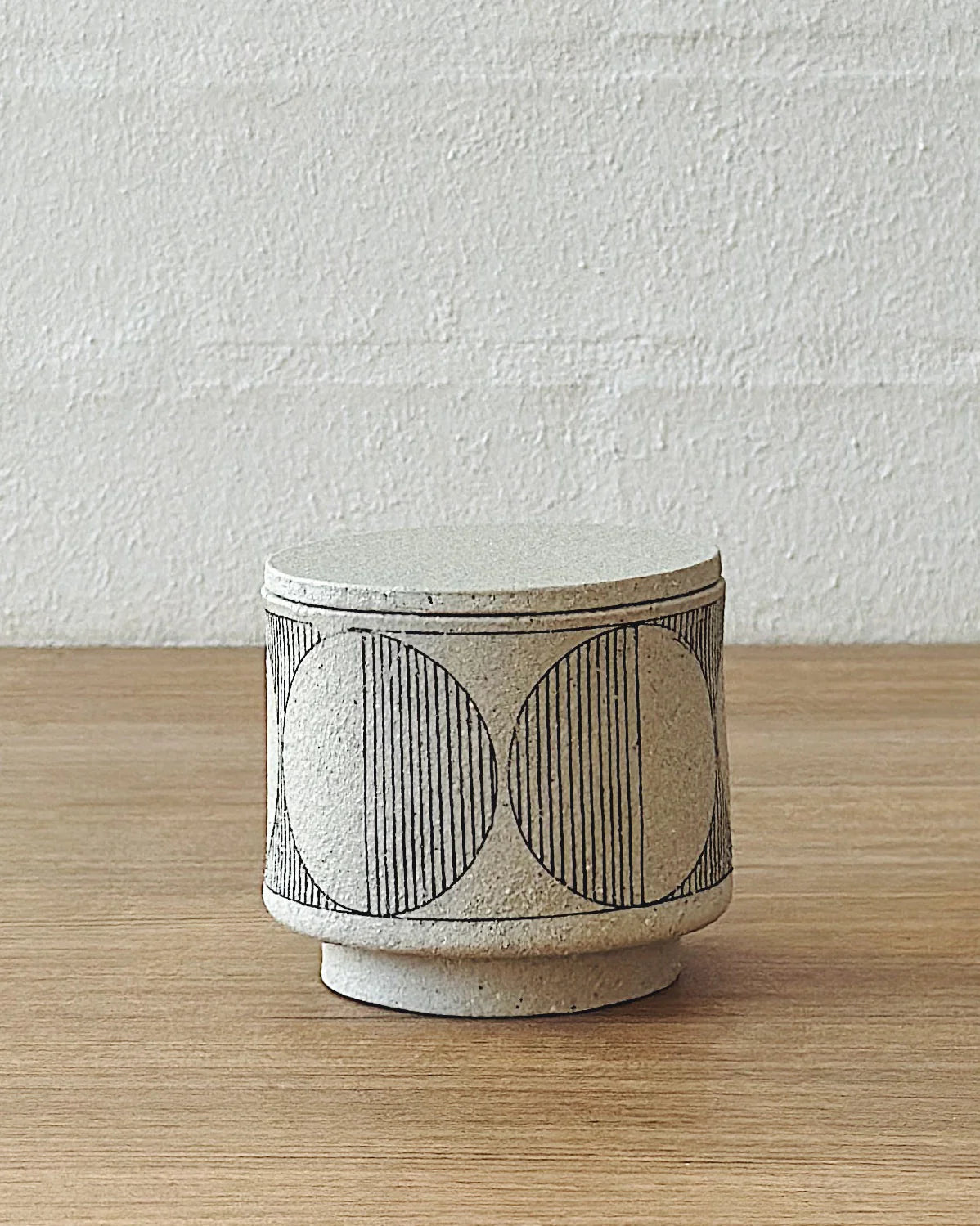 geometric white lidded vessel